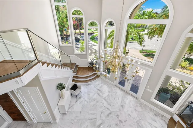 a swimming pool with outdoor seating and yard