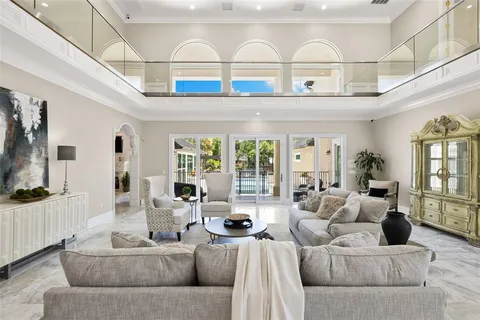 a kitchen with stainless steel appliances granite countertop a stove top oven a sink dishwasher and cabinets with wooden floor