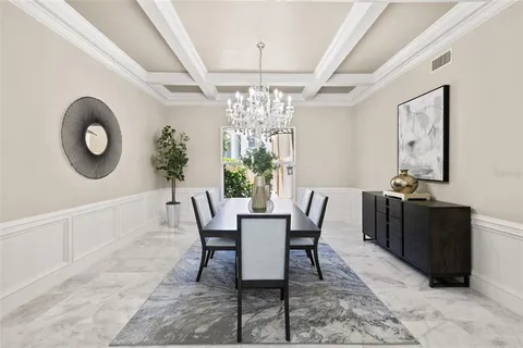 a room with pool table and windows