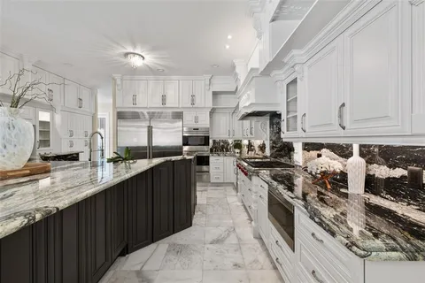 a spacious bedroom with a bed and a couch