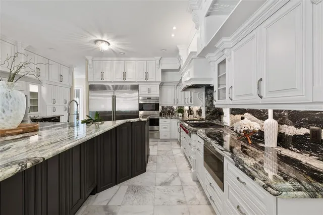 a spacious bedroom with a bed and a couch