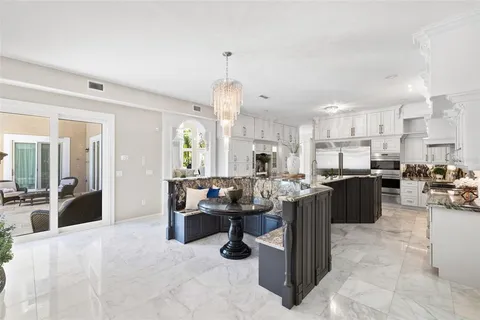 a spacious en suite bathroom with a double vanity sink and a mirror