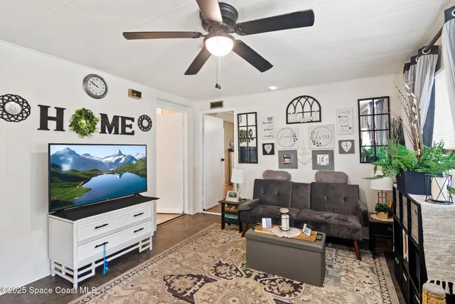 a bedroom with bed and a chandelier