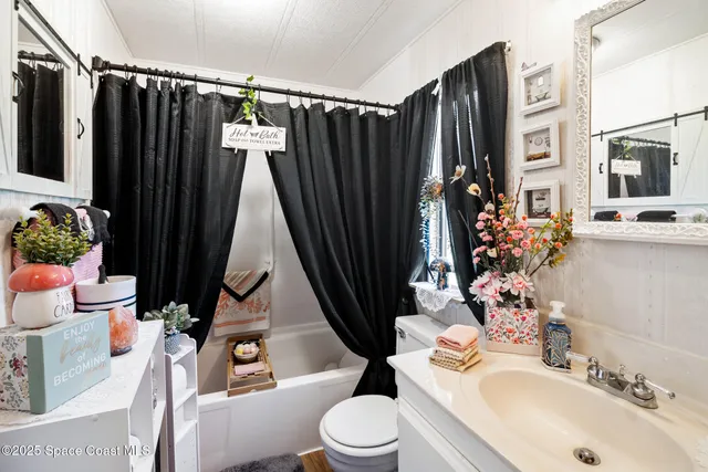 a sign that is in front of flowers