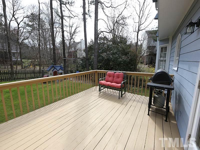 6 Striding Ridge Court Durham, NC 27713 - Photo 22 of 25 a view of balcony with wooden floor and outdoor seating