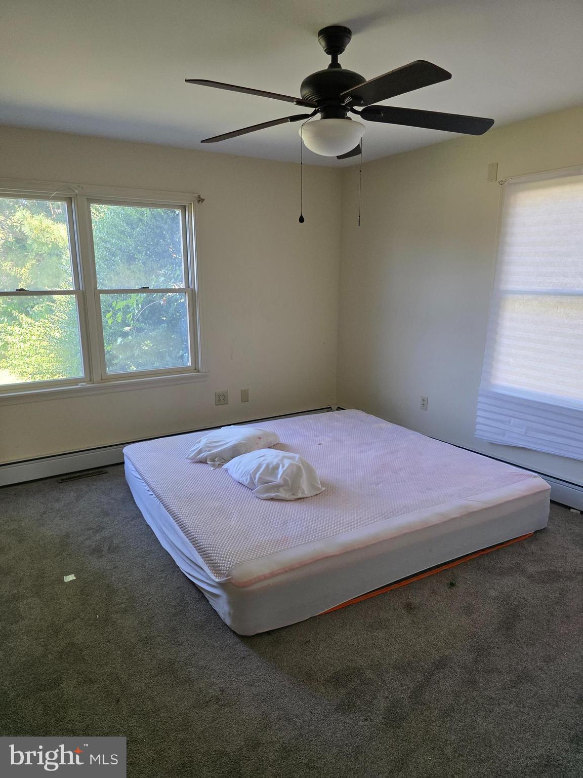 706 East Division Street Dover, DE 19901 - Photo 15 of 16 a bedroom with a bed and a window