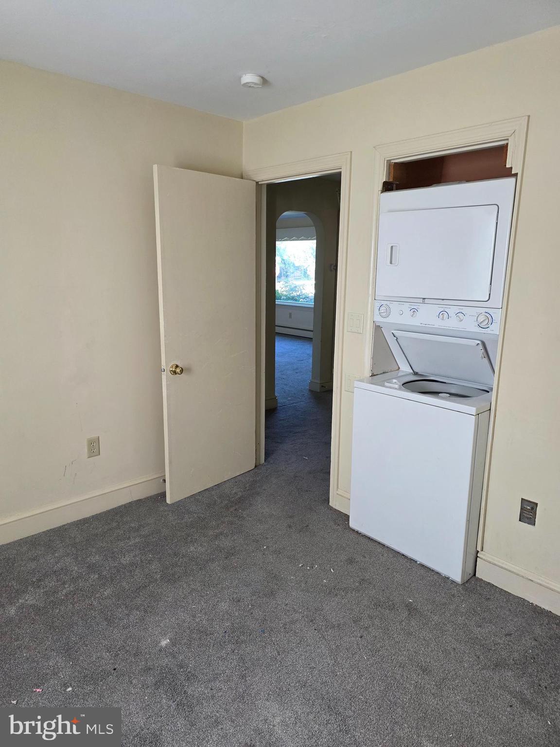 706 East Division Street Dover, DE 19901 - Photo 10 of 16 an empty room with a washer and dryer
