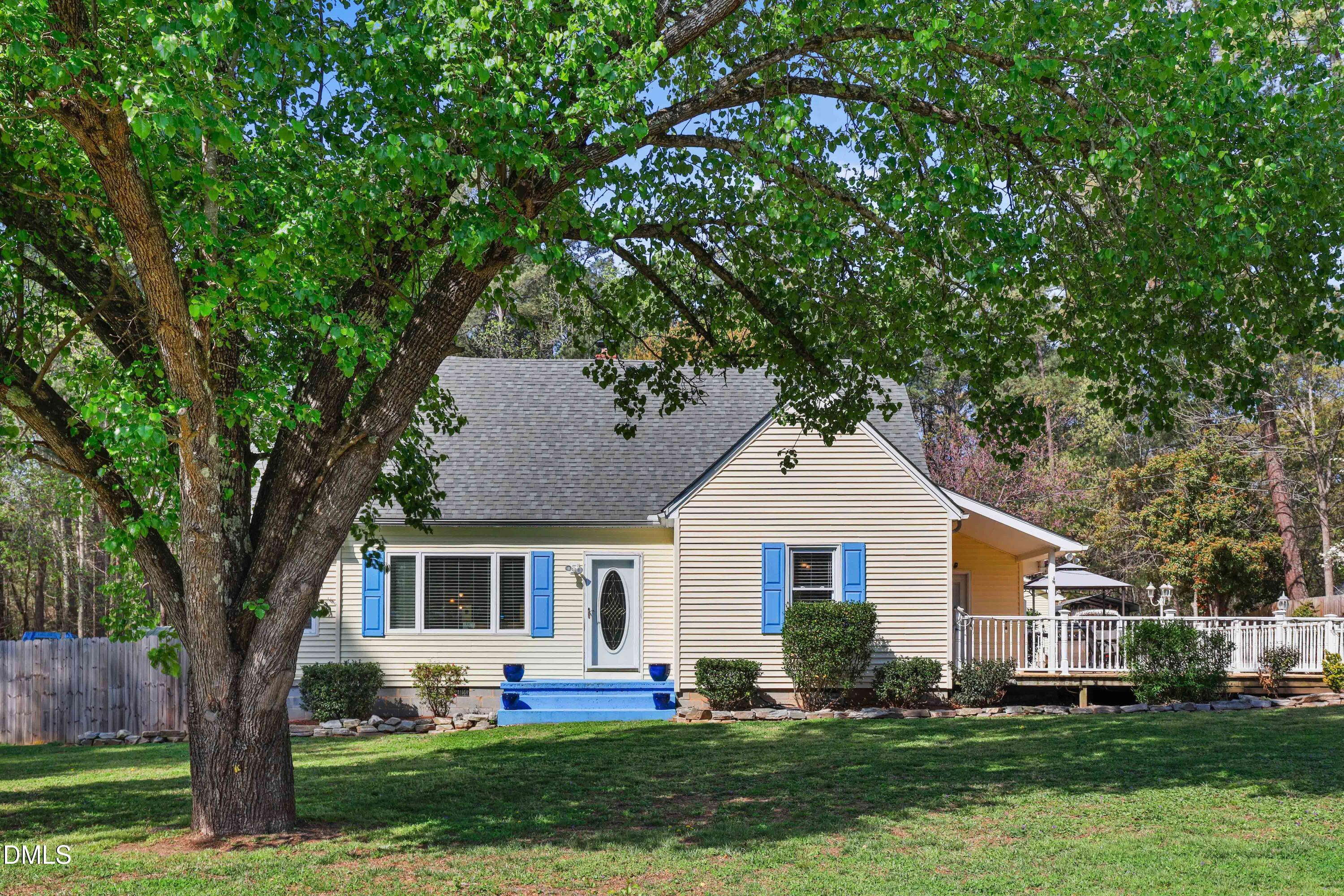 1491 Farrington Point Road Chapel Hill, NC 27517 - Photo 1 of 52 a front view of a house with a yard and trees