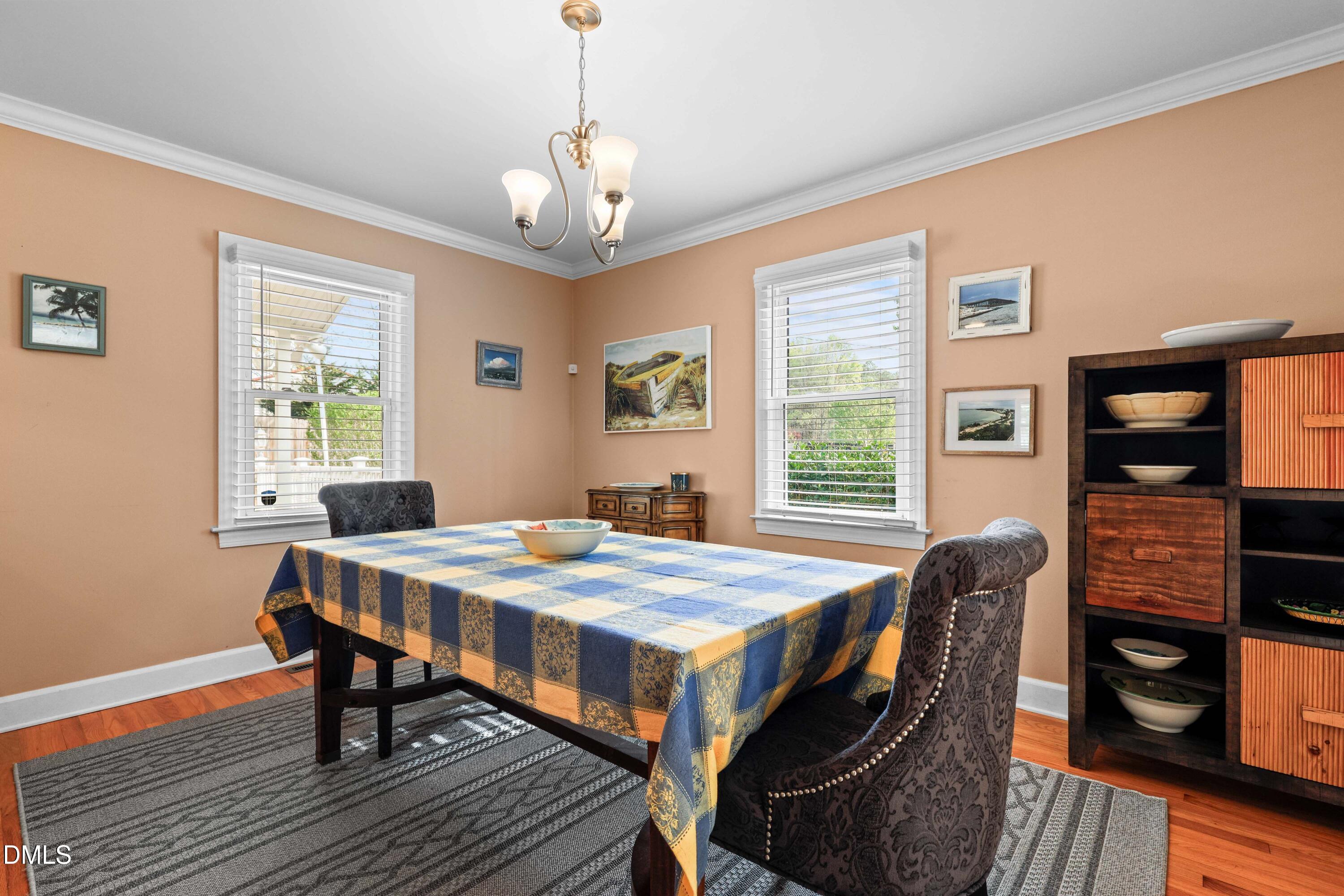 1491 Farrington Point Road Chapel Hill, NC 27517 - Photo 13 of 52 a view of a dining room with furniture window and wooden floor