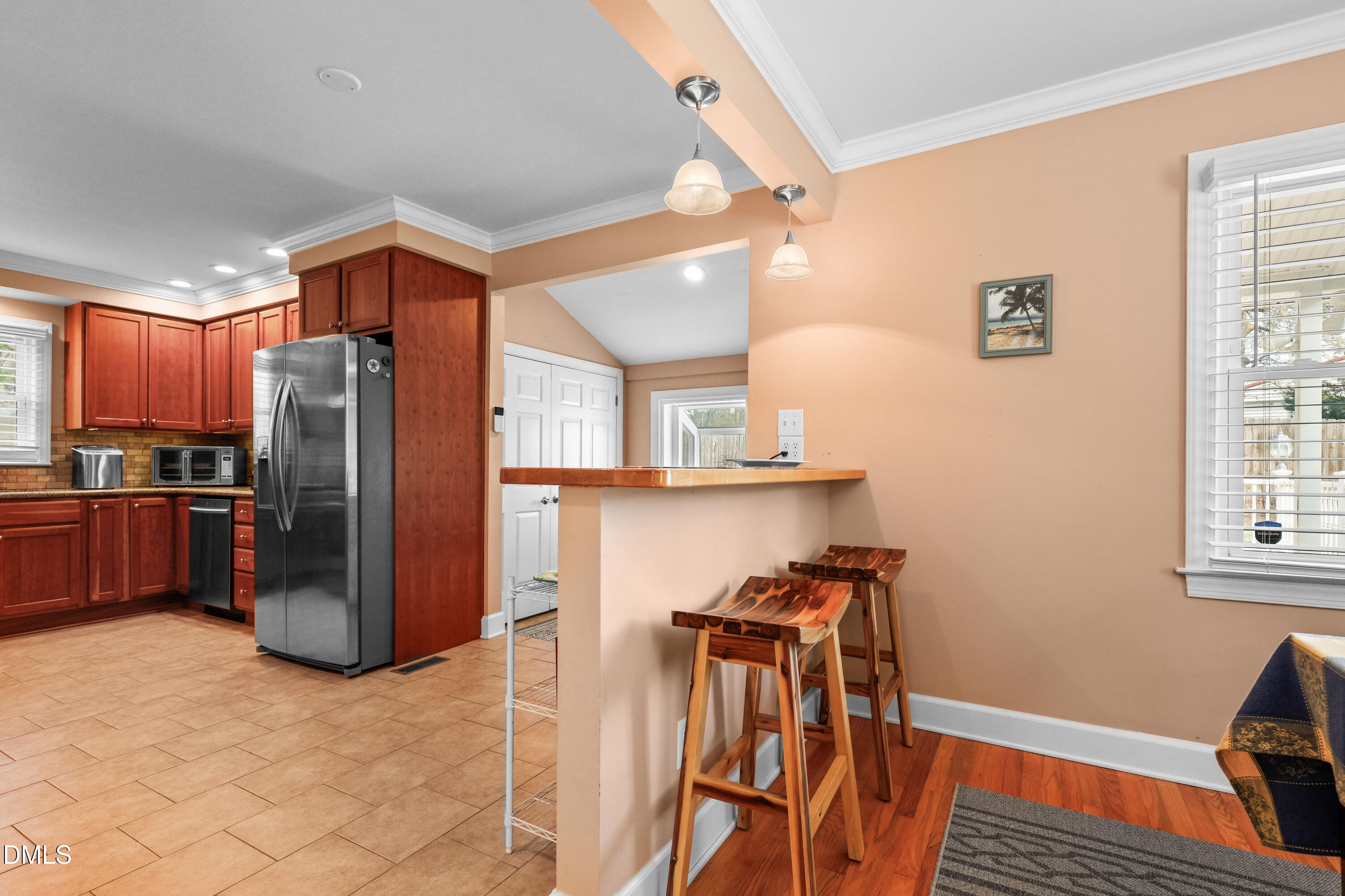 1491 Farrington Point Road Chapel Hill, NC 27517 - Photo 16 of 52 a kitchen with stainless steel appliances granite countertop a refrigerator and a sink