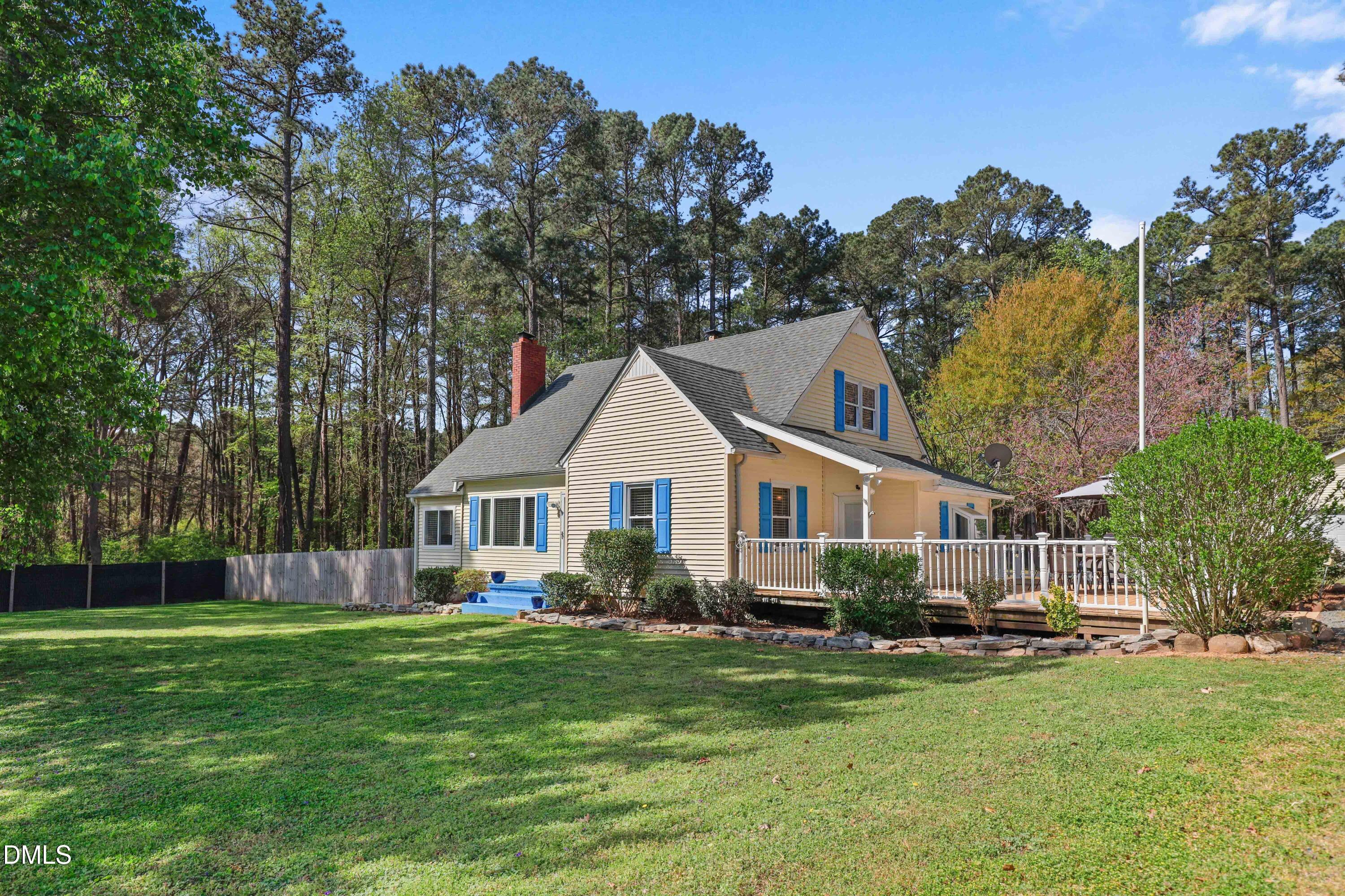 1491 Farrington Point Road Chapel Hill, NC 27517 - Photo 2 of 52 a front view of a house with a garden