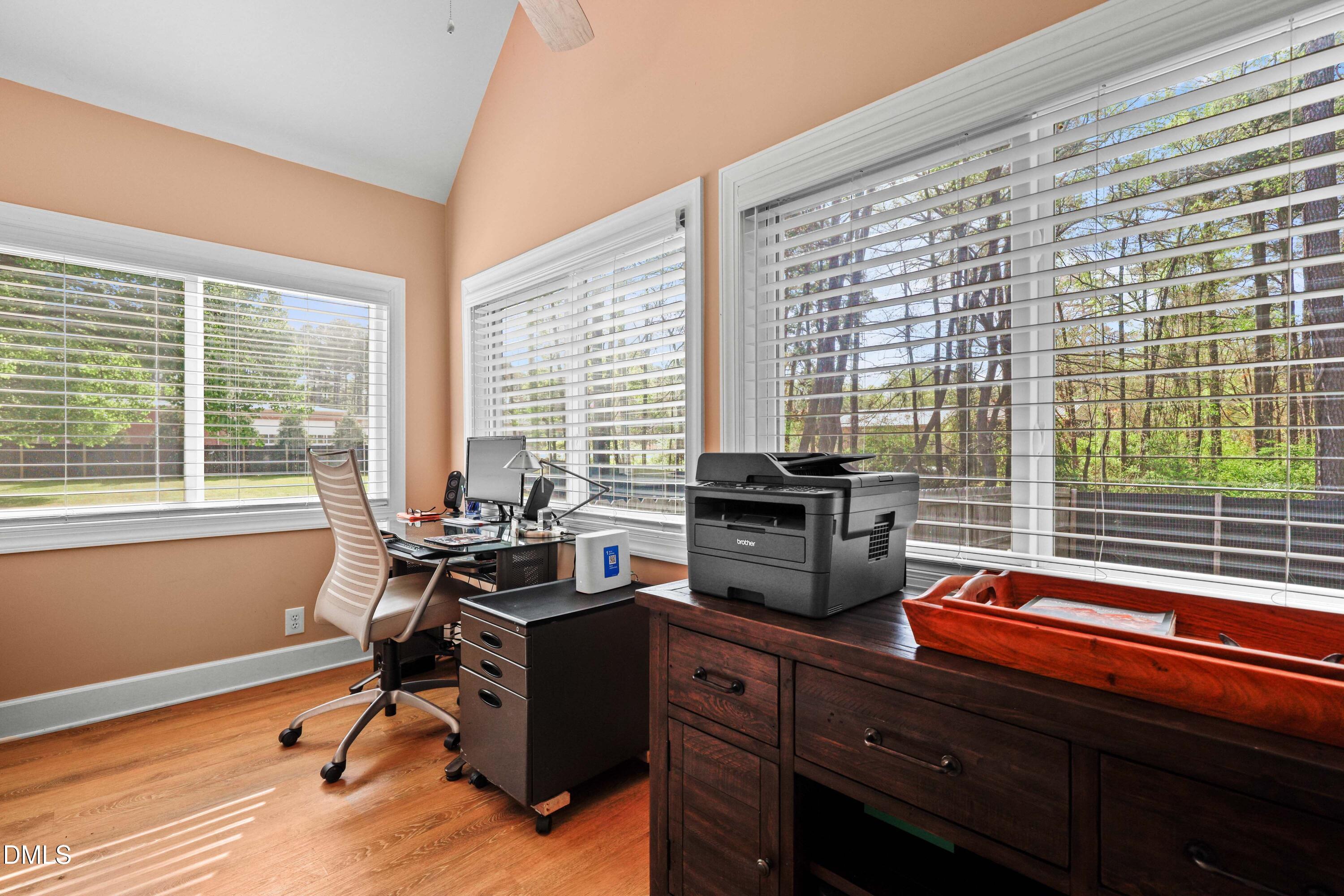 1491 Farrington Point Road Chapel Hill, NC 27517 - Photo 21 of 52 a view of a workspace with furniture and a window