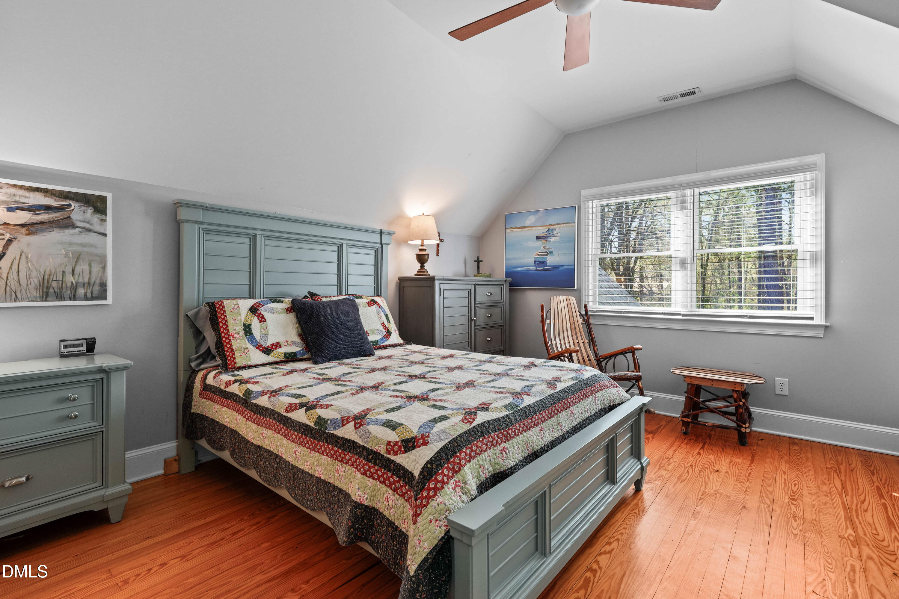 1491 Farrington Point Road Chapel Hill, NC 27517 - Photo 26 of 52 a bed sitting in a bedroom next to a window with a dresser