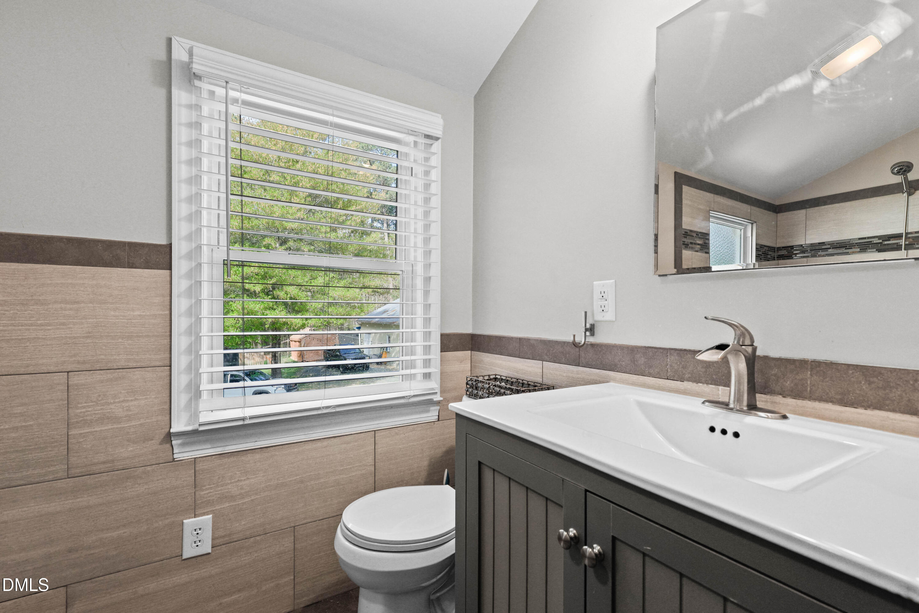 1491 Farrington Point Road Chapel Hill, NC 27517 - Photo 28 of 52 a bathroom with a sink a toilet and a window