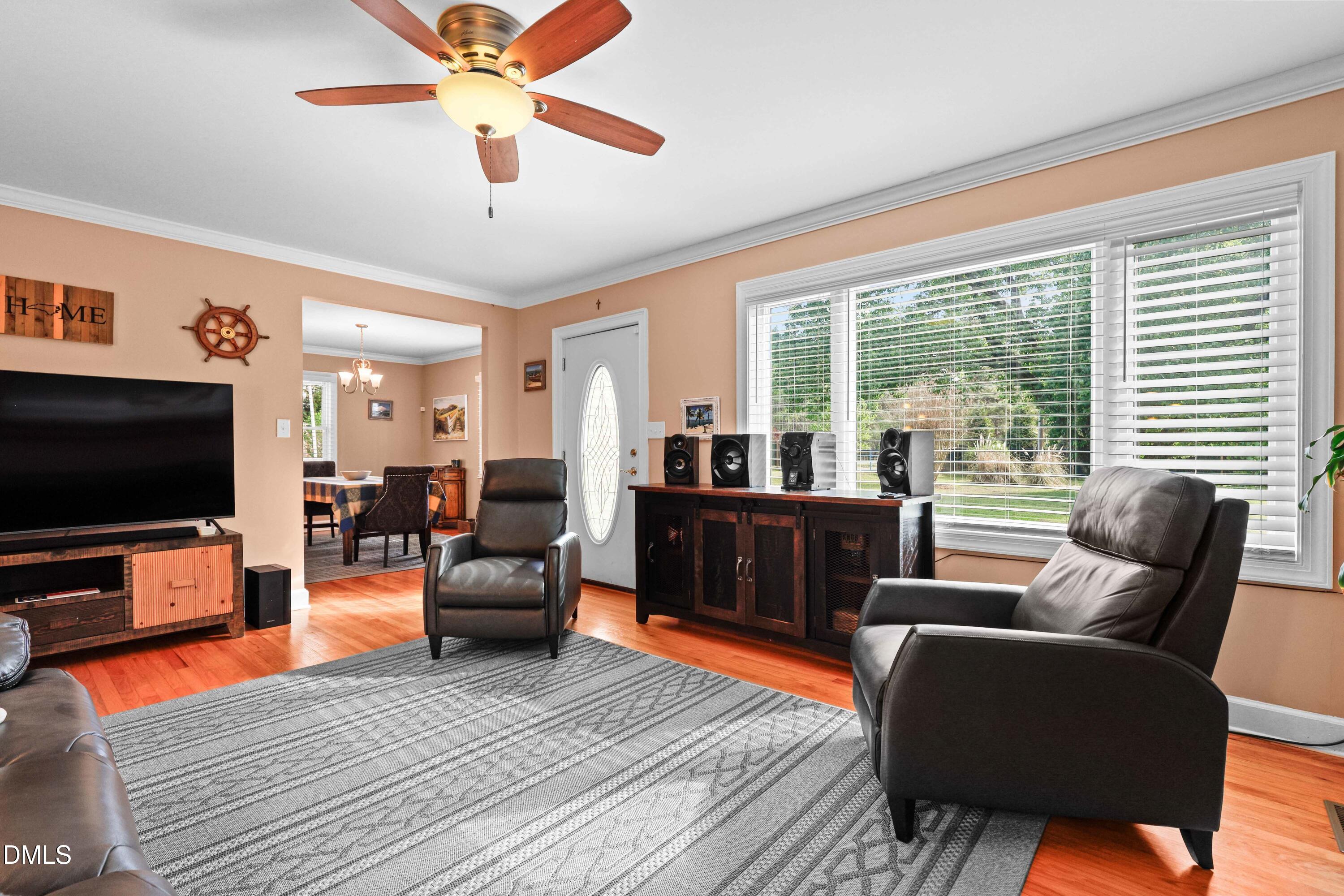 1491 Farrington Point Road Chapel Hill, NC 27517 - Photo 3 of 52 a living room with furniture and a flat screen tv