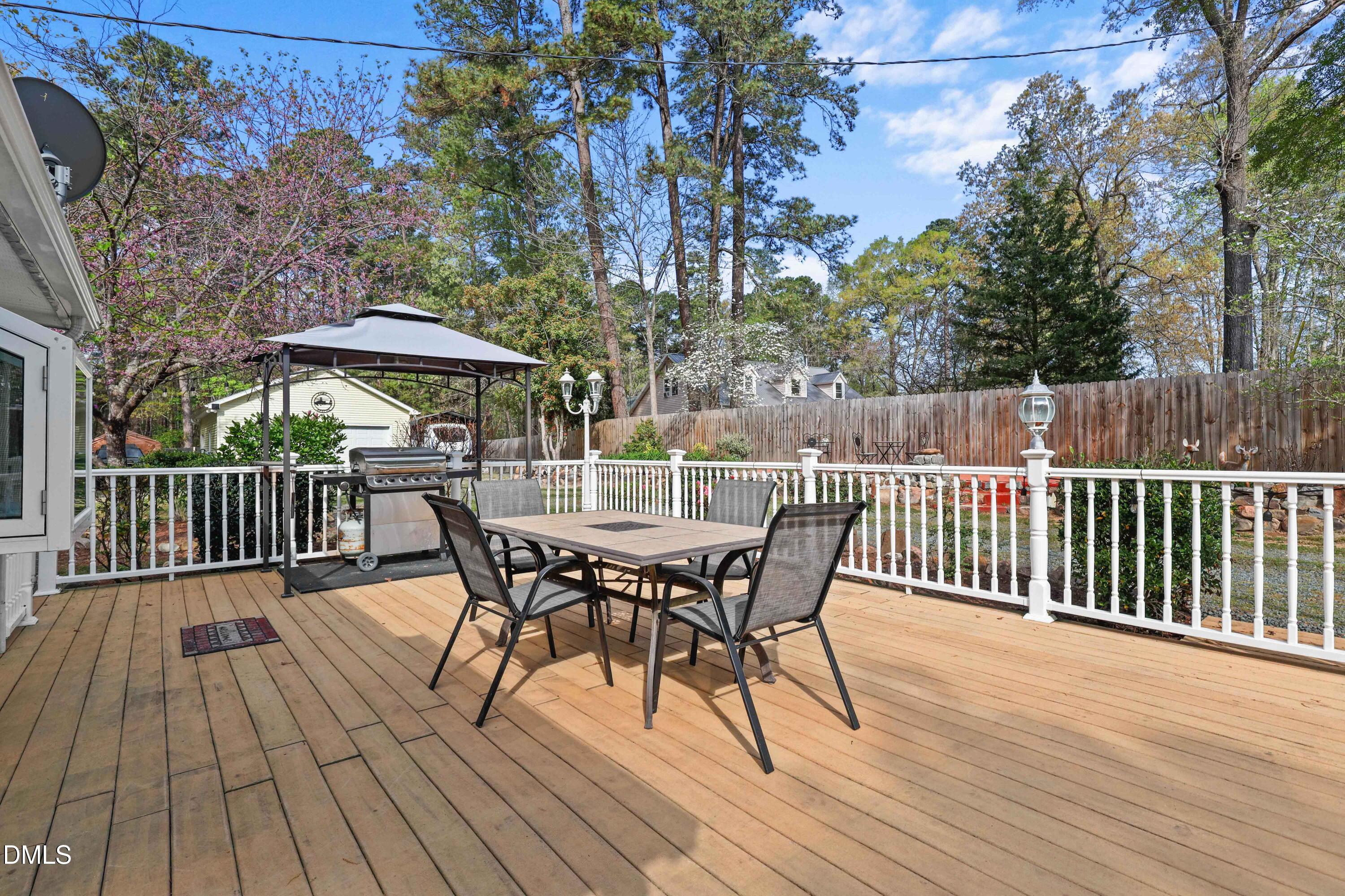 1491 Farrington Point Road Chapel Hill, NC 27517 - Photo 33 of 52 a view of a deck with furniture and trees
