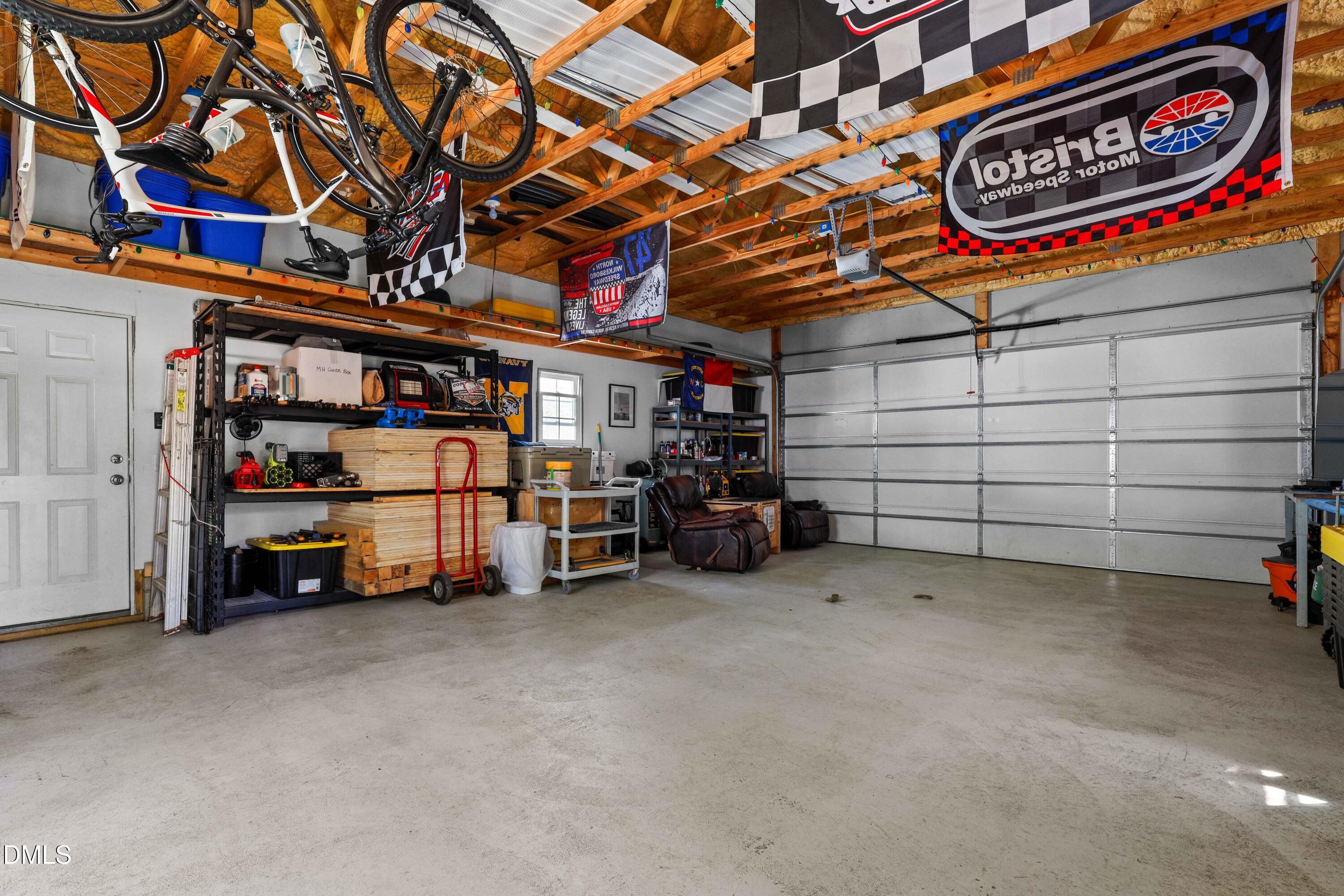 1491 Farrington Point Road Chapel Hill, NC 27517 - Photo 43 of 52 a view of a garage with storage and utility