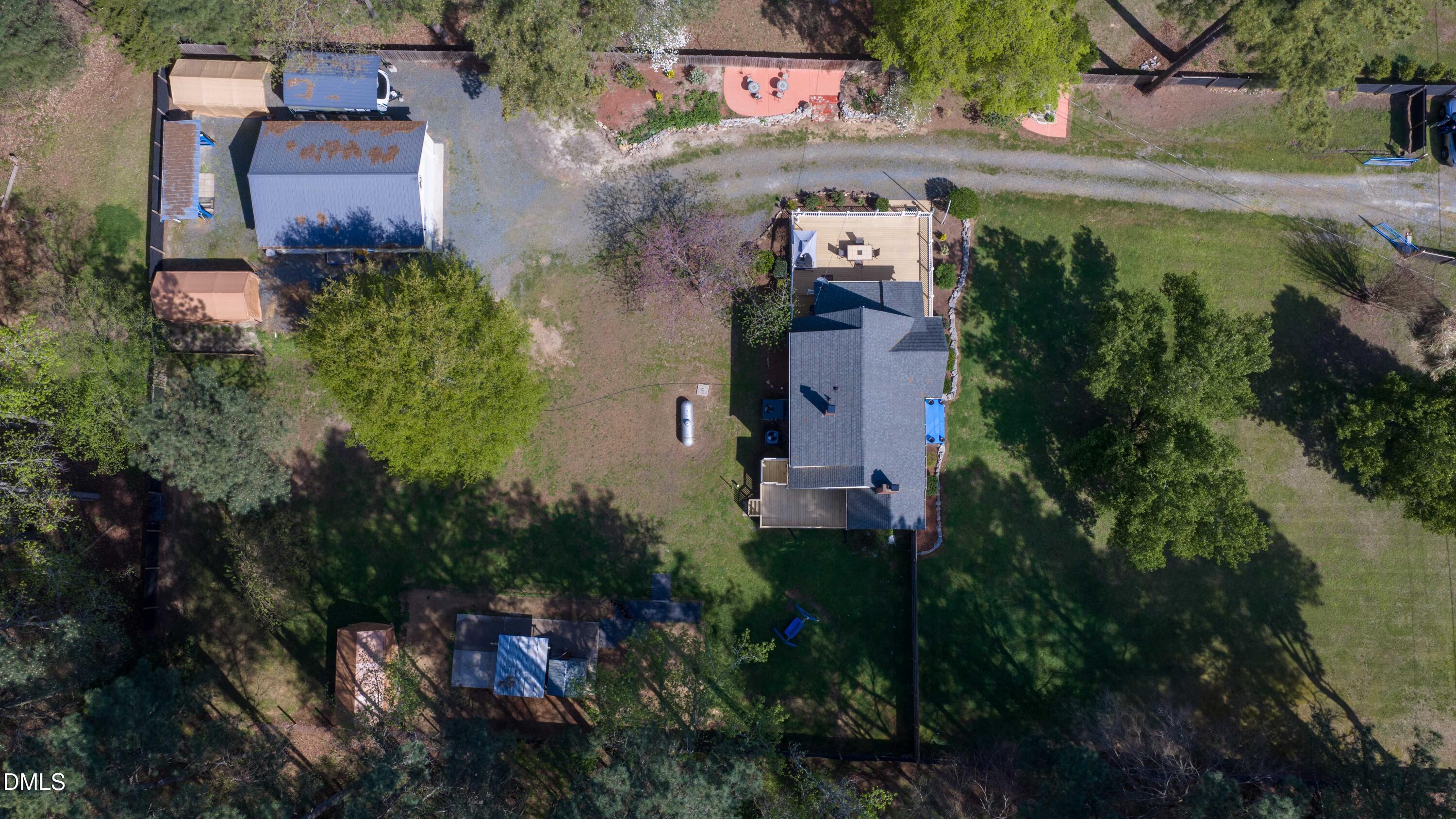 1491 Farrington Point Road Chapel Hill, NC 27517 - Photo 49 of 52 an aerial view of a house with a yard and garden