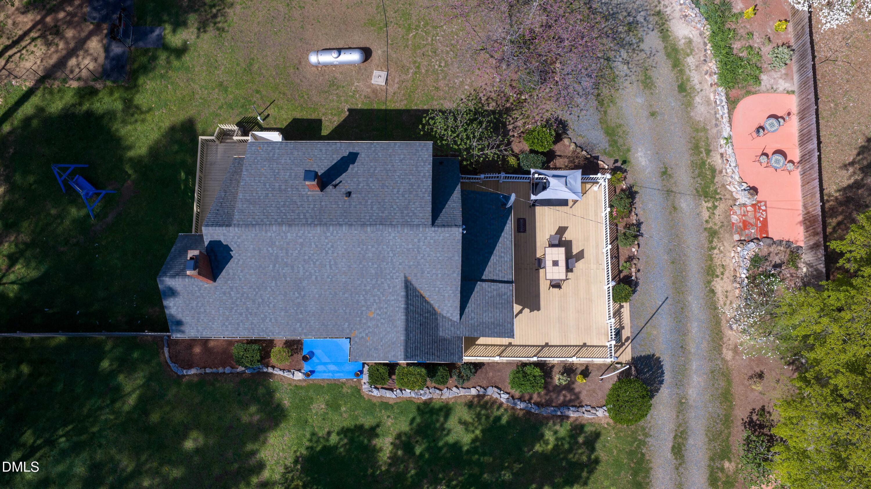 1491 Farrington Point Road Chapel Hill, NC 27517 - Photo 50 of 52 an aerial view of a house with a yard and pool