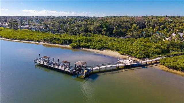 an aerial view of a house with a lake view