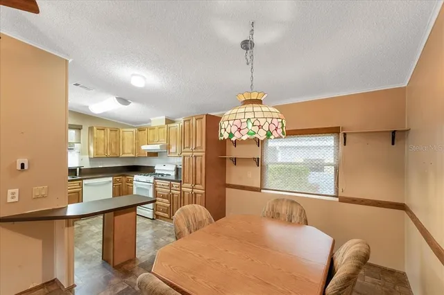 a bedroom with furniture and a chandelier