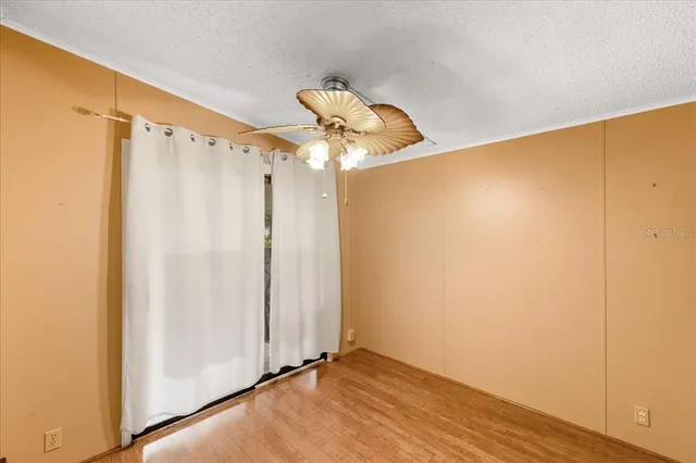 a view of a room with wooden floor