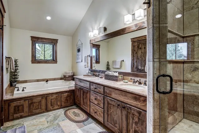 a bathroom with a sink double vanity and a mirror