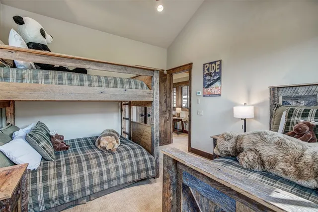 a bedroom with furniture and a lamp