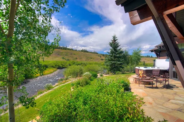 a view of a balcony with wooden floor and fence