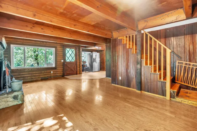 a view of a kitchen with a refrigerator and a stove