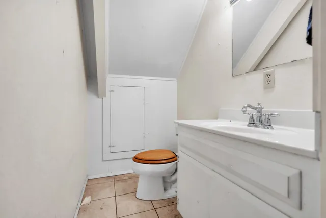 a view of a chairs and table in the back yard of the house