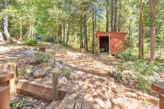 a backyard of a house with table and chairs