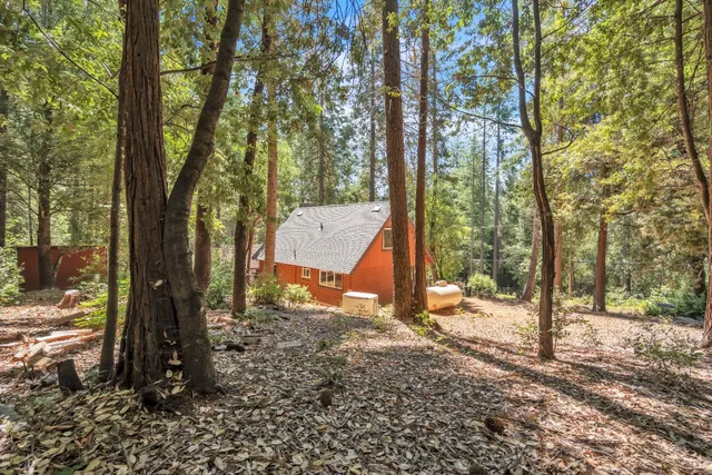a house view with a backyard space