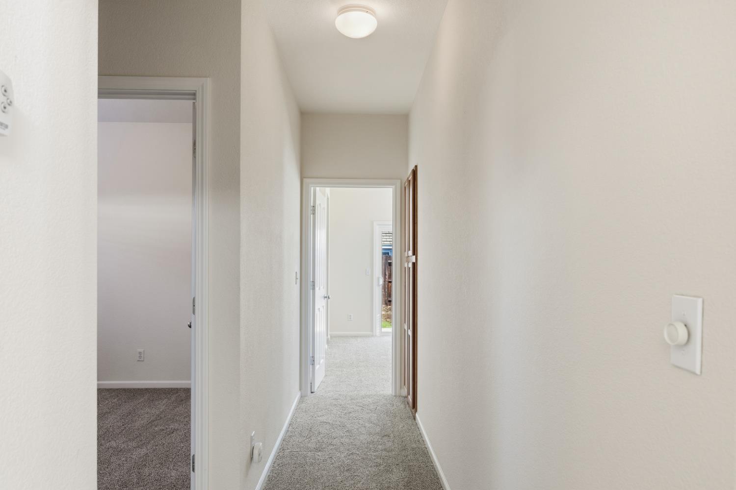 170 Par Court Ione, CA 95640 - Photo 11 of 31 a view of a hallway with wooden floor