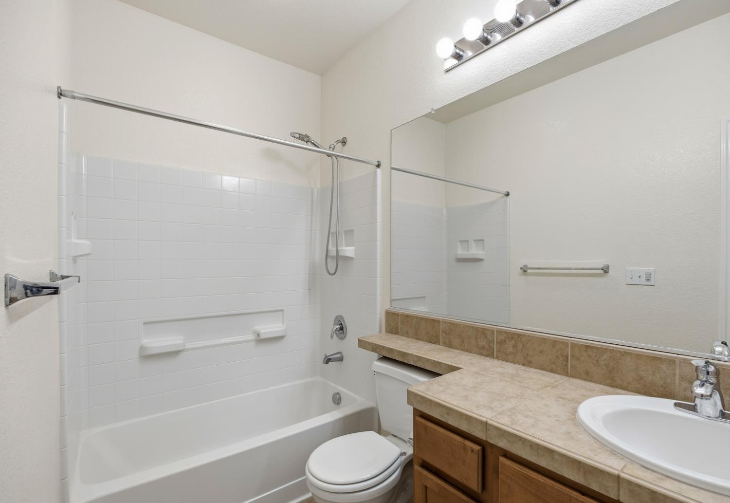 170 Par Court Ione, CA 95640 - Photo 12 of 31 a bathroom with a sink a toilet and a bathtub