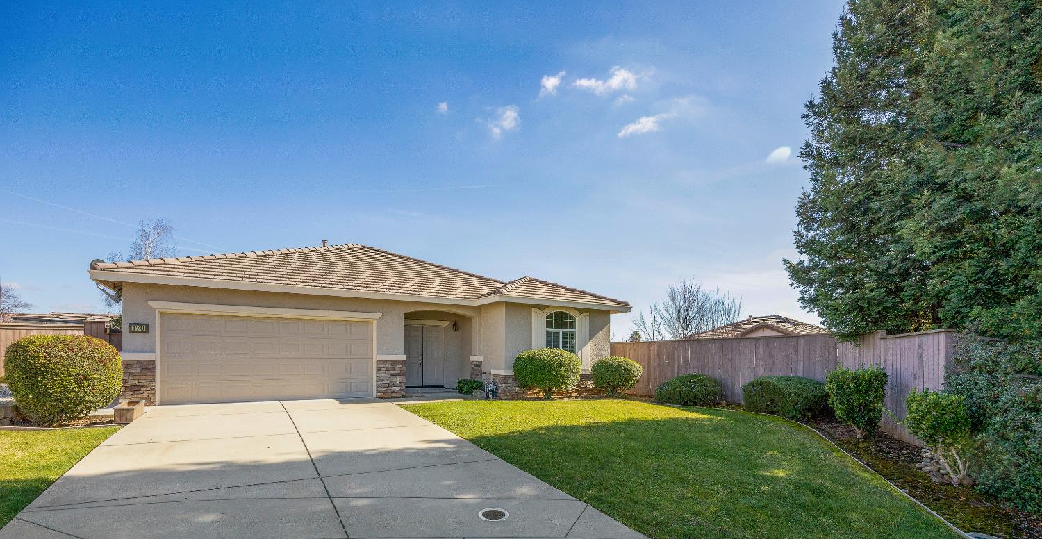 170 Par Court Ione, CA 95640 - Photo 2 of 31 a front view of a house with a yard and garage