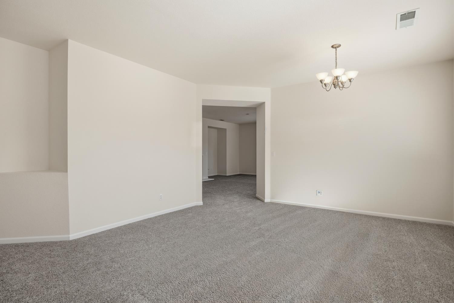 170 Par Court Ione, CA 95640 - Photo 4 of 31 an empty room with a mirror