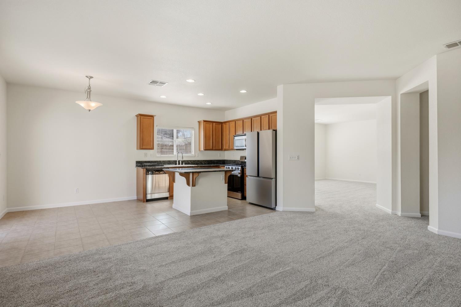 170 Par Court Ione, CA 95640 - Photo 9 of 31 a view of kitchen with stainless steel appliances kitchen island