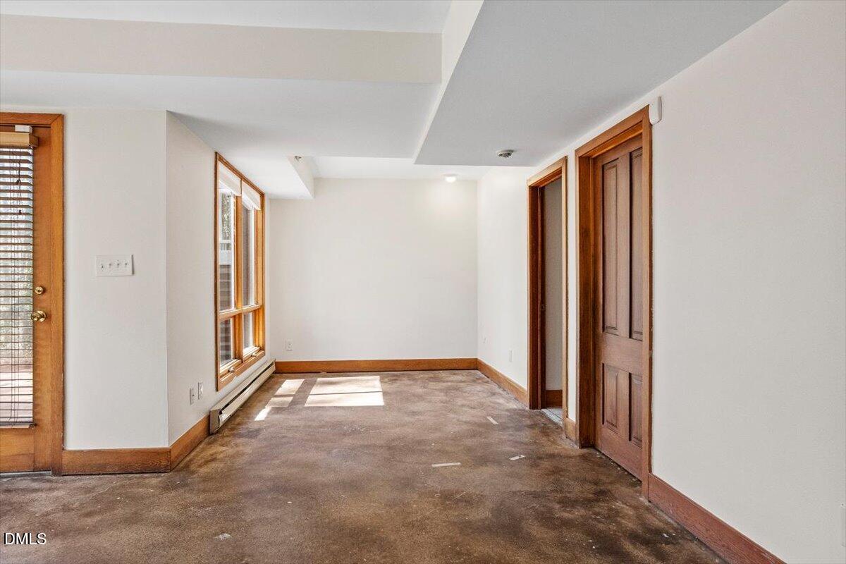 4805 Rembert Drive Raleigh, NC 27612 - Photo 31 of 45 an empty room with windows