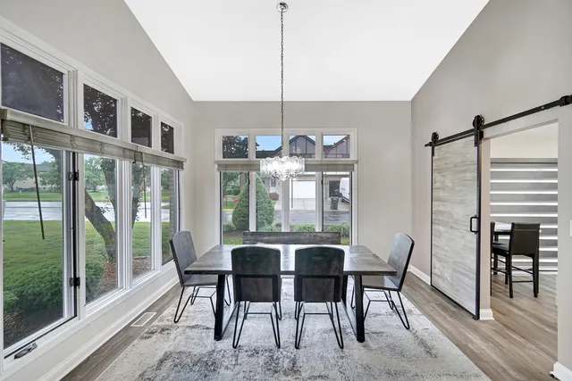a view of a dining room with furniture window and outside view