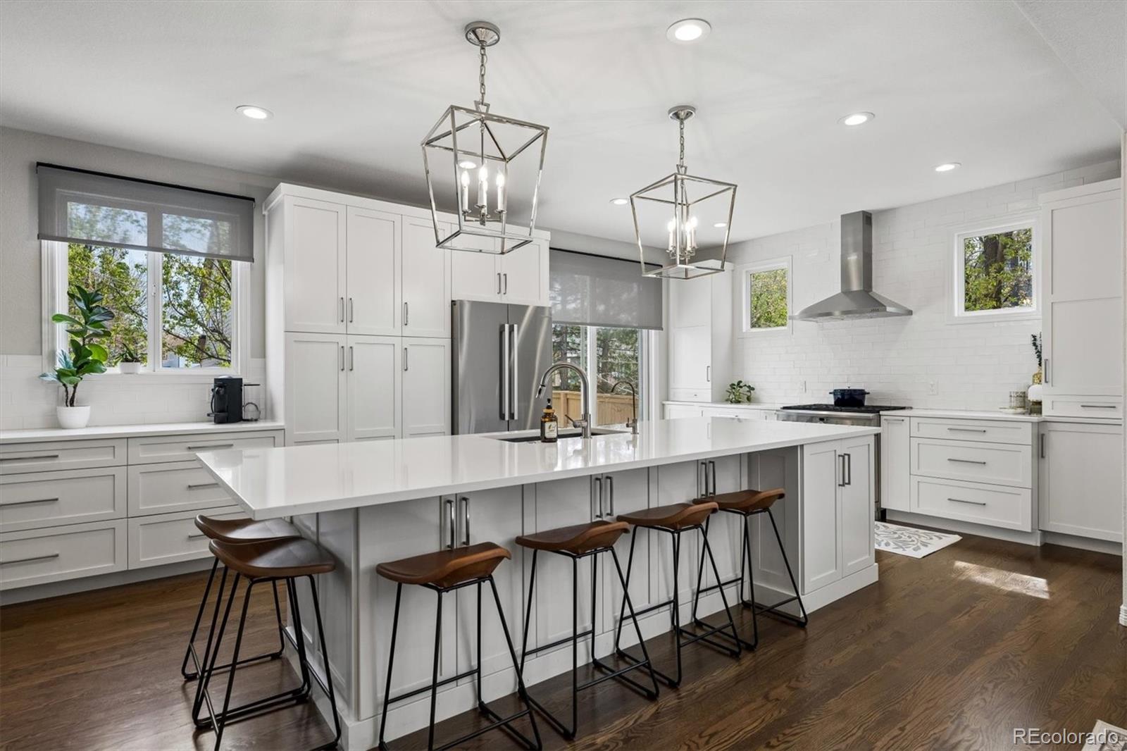 2677 Pemberly Avenue Highlands Ranch, CO 80126 - Photo 12 of 50 a large kitchen with lots of counter space and appliances