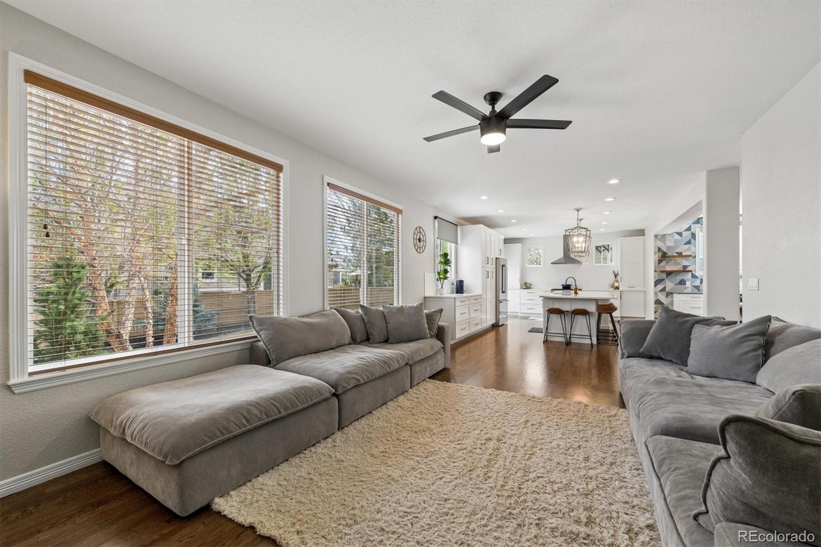 2677 Pemberly Avenue Highlands Ranch, CO 80126 - Photo 18 of 50 a living room with furniture and a large window