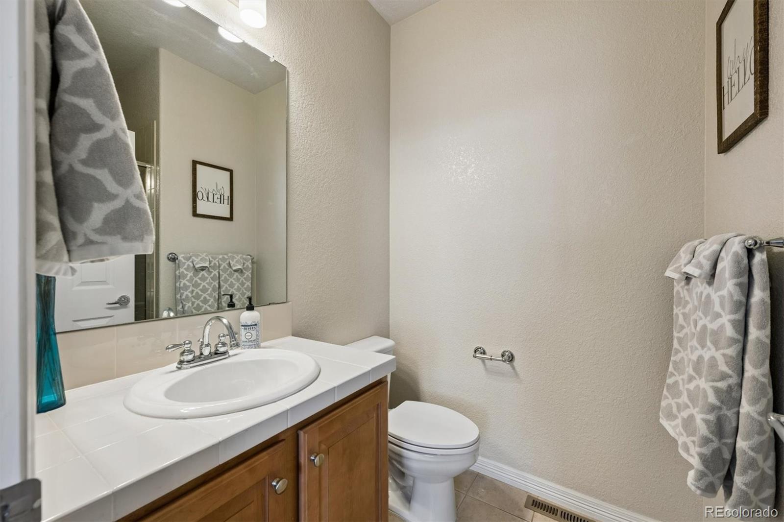 2677 Pemberly Avenue Highlands Ranch, CO 80126 - Photo 20 of 50 a bathroom with a sink and a mirror