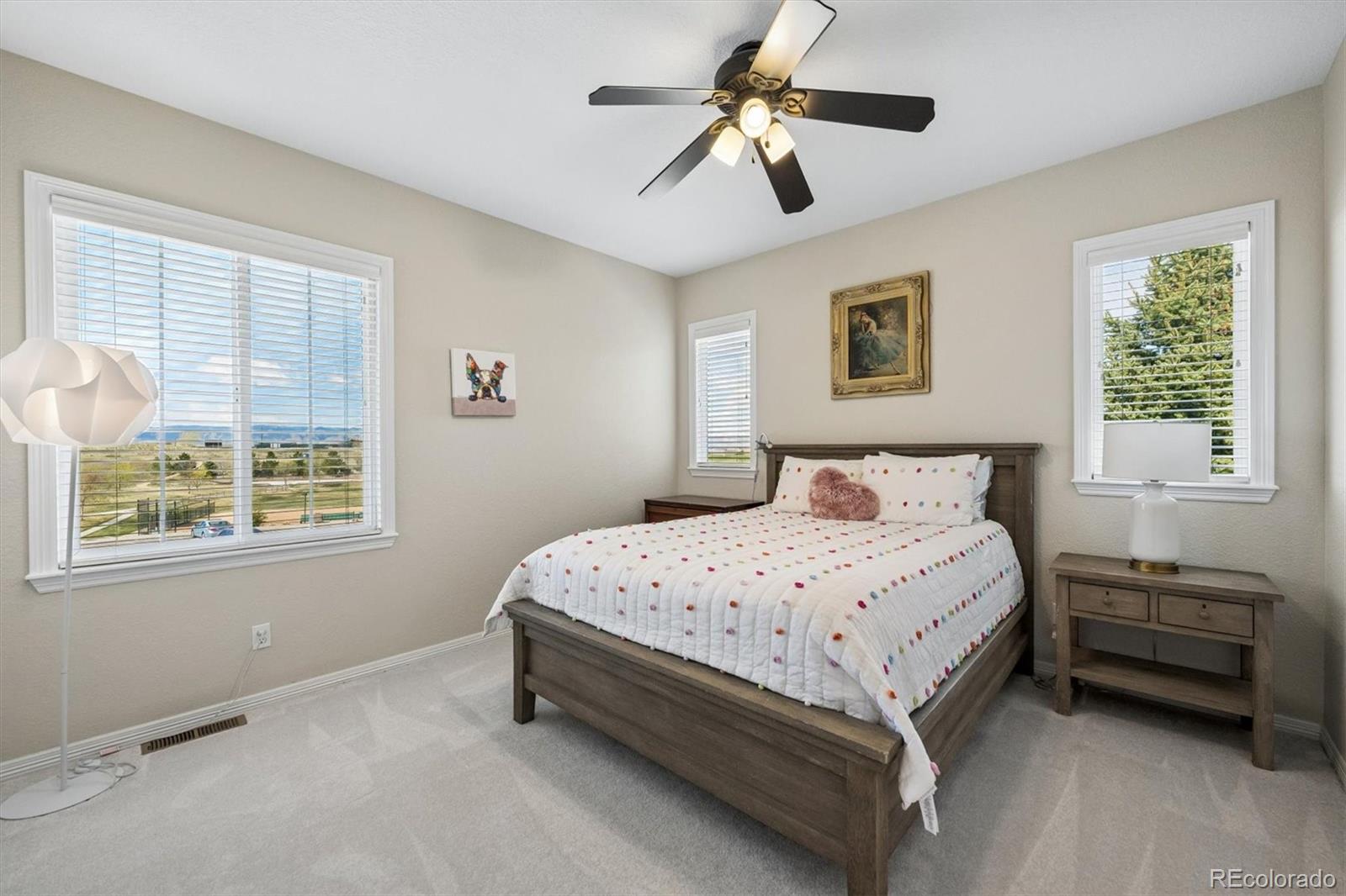 2677 Pemberly Avenue Highlands Ranch, CO 80126 - Photo 29 of 50 a bedroom with a bed next to a window