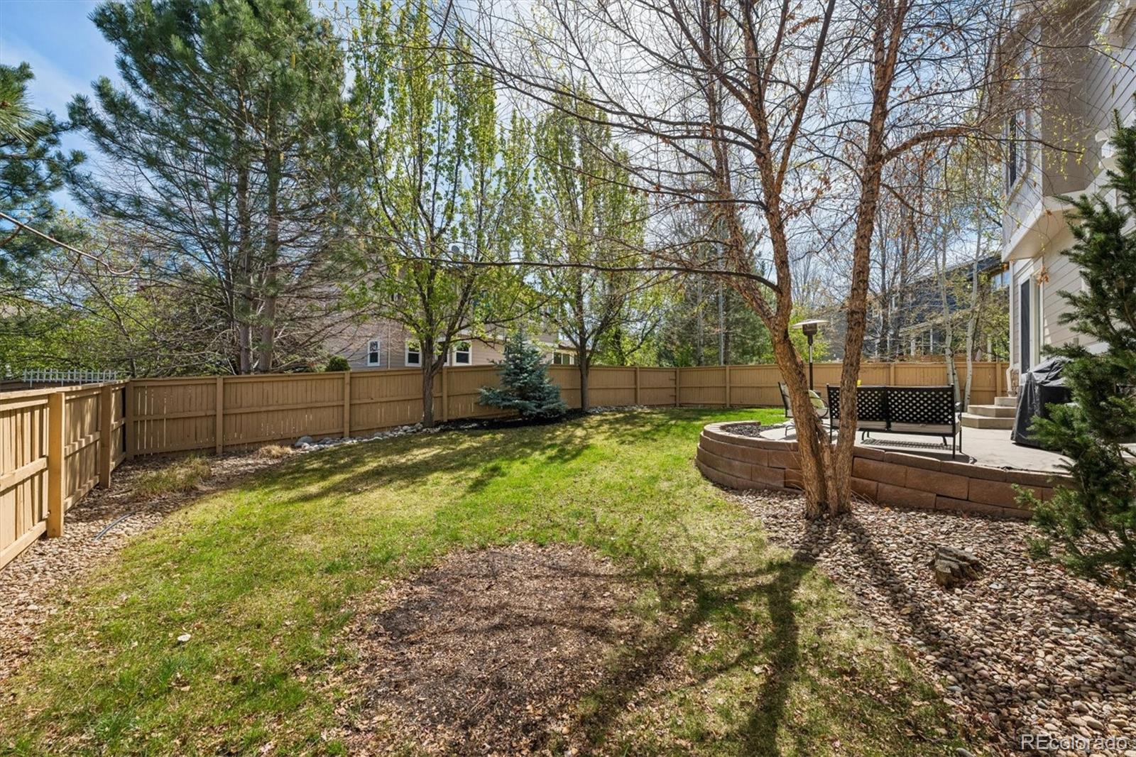 2677 Pemberly Avenue Highlands Ranch, CO 80126 - Photo 39 of 50 a view of backyard with tree