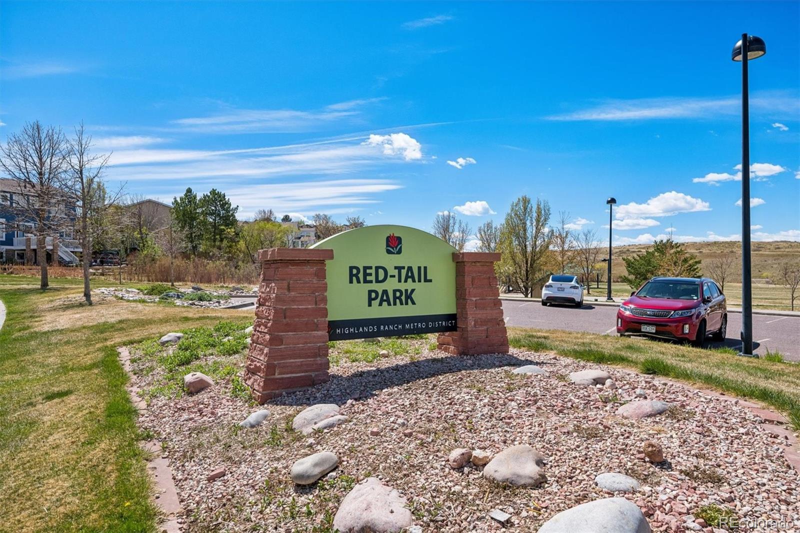 2677 Pemberly Avenue Highlands Ranch, CO 80126 - Photo 45 of 50 a view of a sign board with a park
