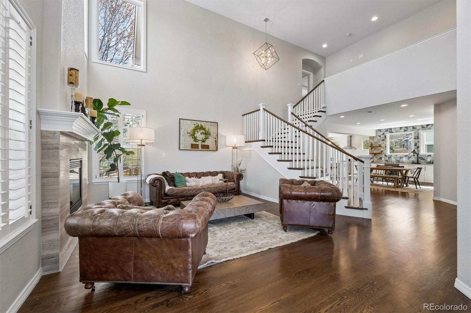 2677 Pemberly Avenue Highlands Ranch, CO 80126 - Photo 6 of 50 a living room with furniture and wooden floor