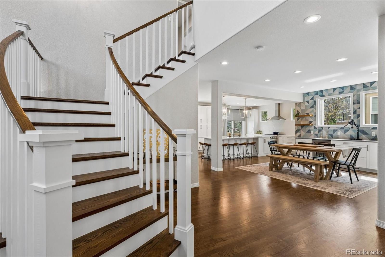 2677 Pemberly Avenue Highlands Ranch, CO 80126 - Photo 9 of 50 a dining room with furniture and wooden floor