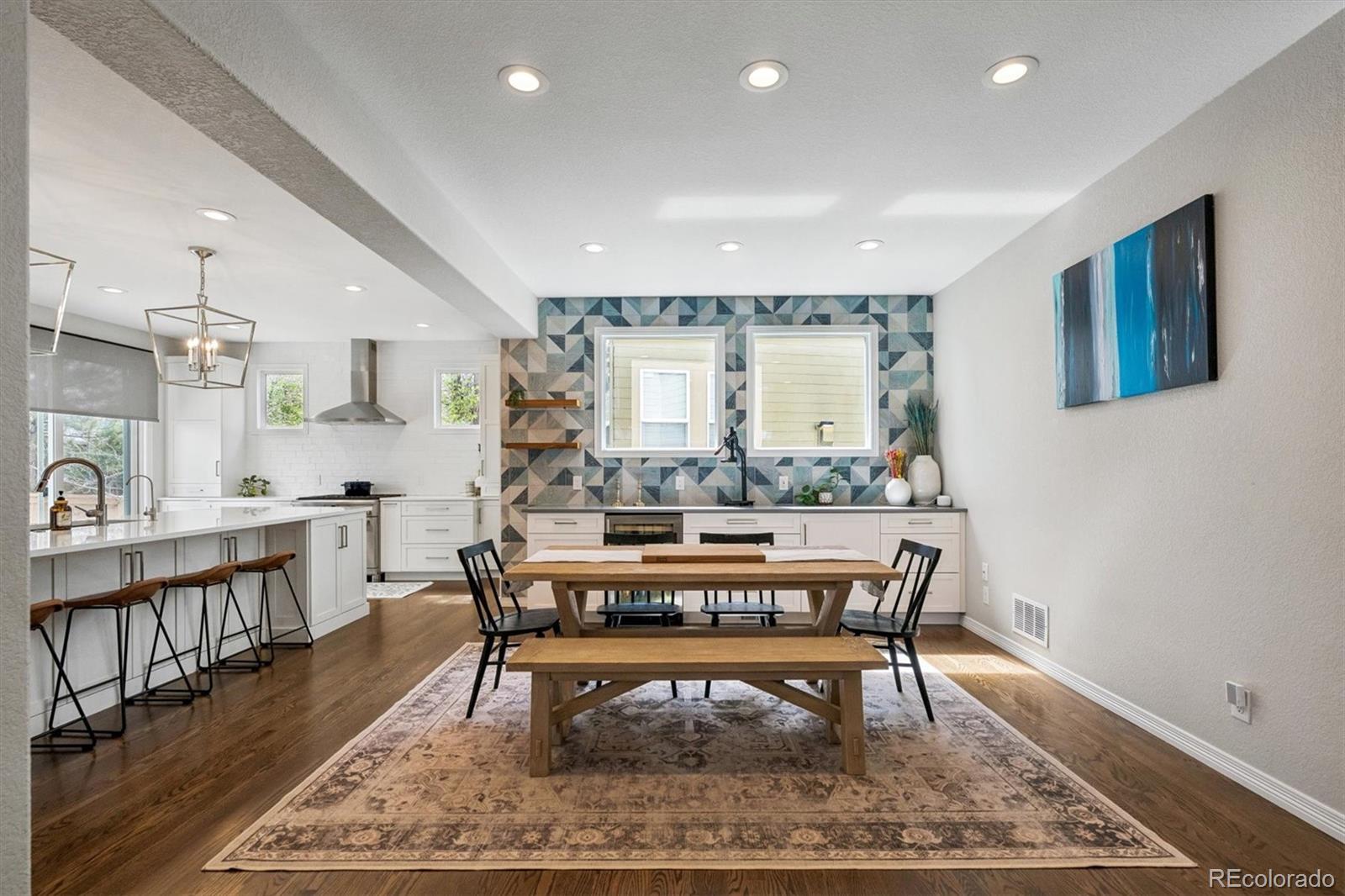 2677 Pemberly Avenue Highlands Ranch, CO 80126 - Photo 10 of 50 a view of a kitchen and dining room