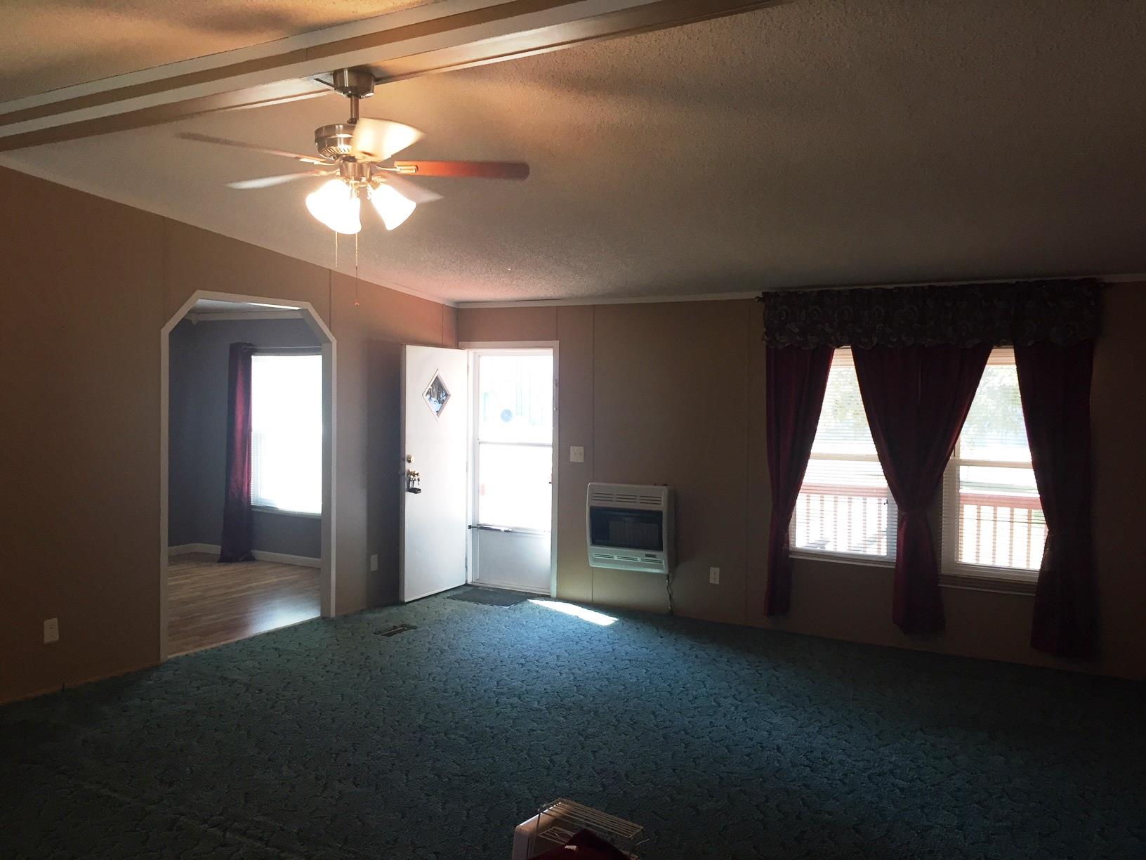 10 Railroad Road Elora, TN 37328 - Photo 3 of 19 a view of empty room with window and chandelier fan